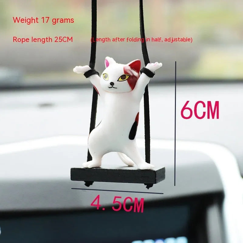Resin cartoon cat pendant for car interior decoration on a rope, shown in multiple colour options.