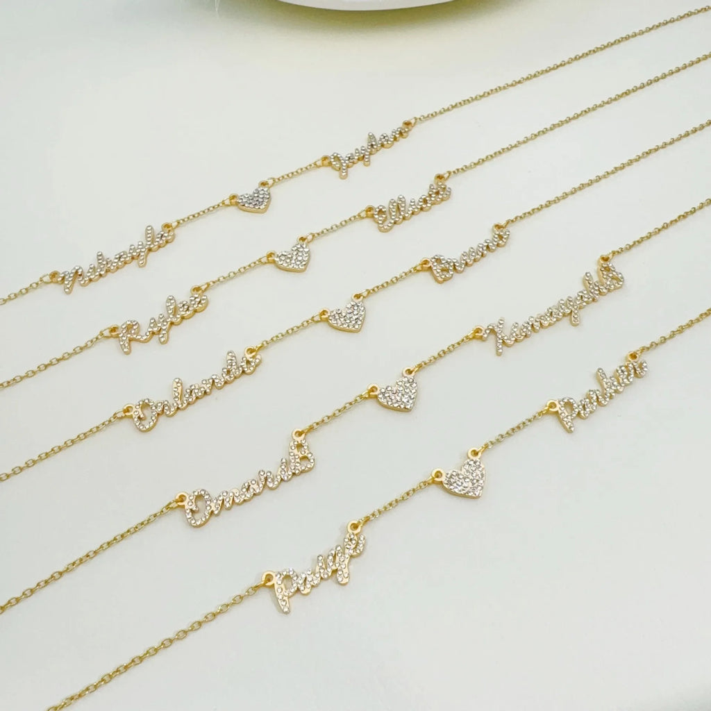 Customised diamond inlaid multi name necklace on stainless steel O-shaped chain, gold finish, with heart charms