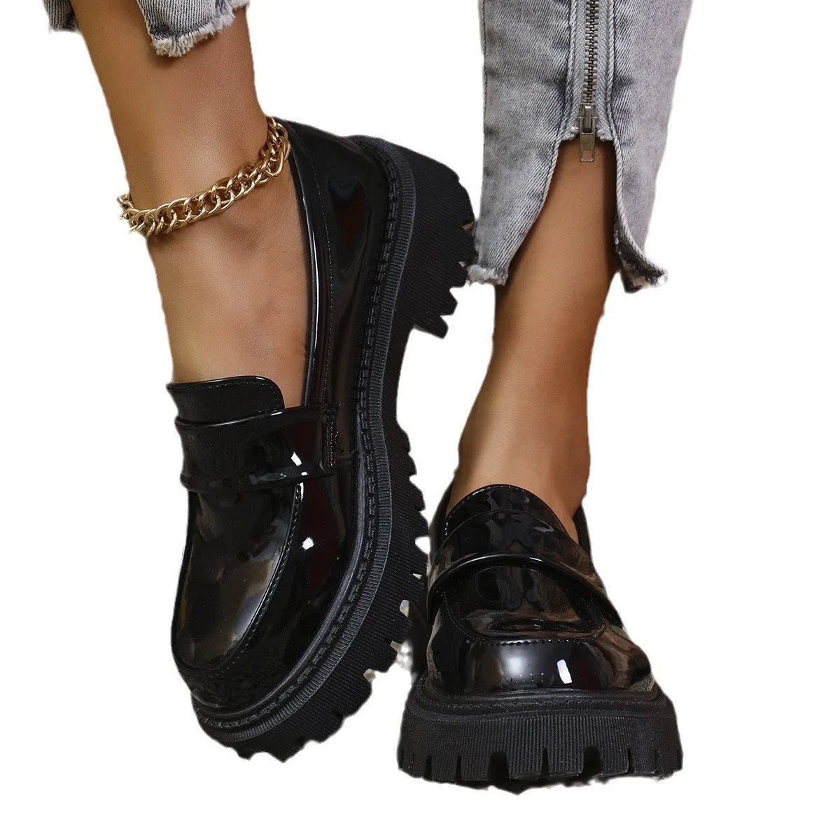 Women's plus size black slip-on loafers with a chunky mid-heel and rubber sole.