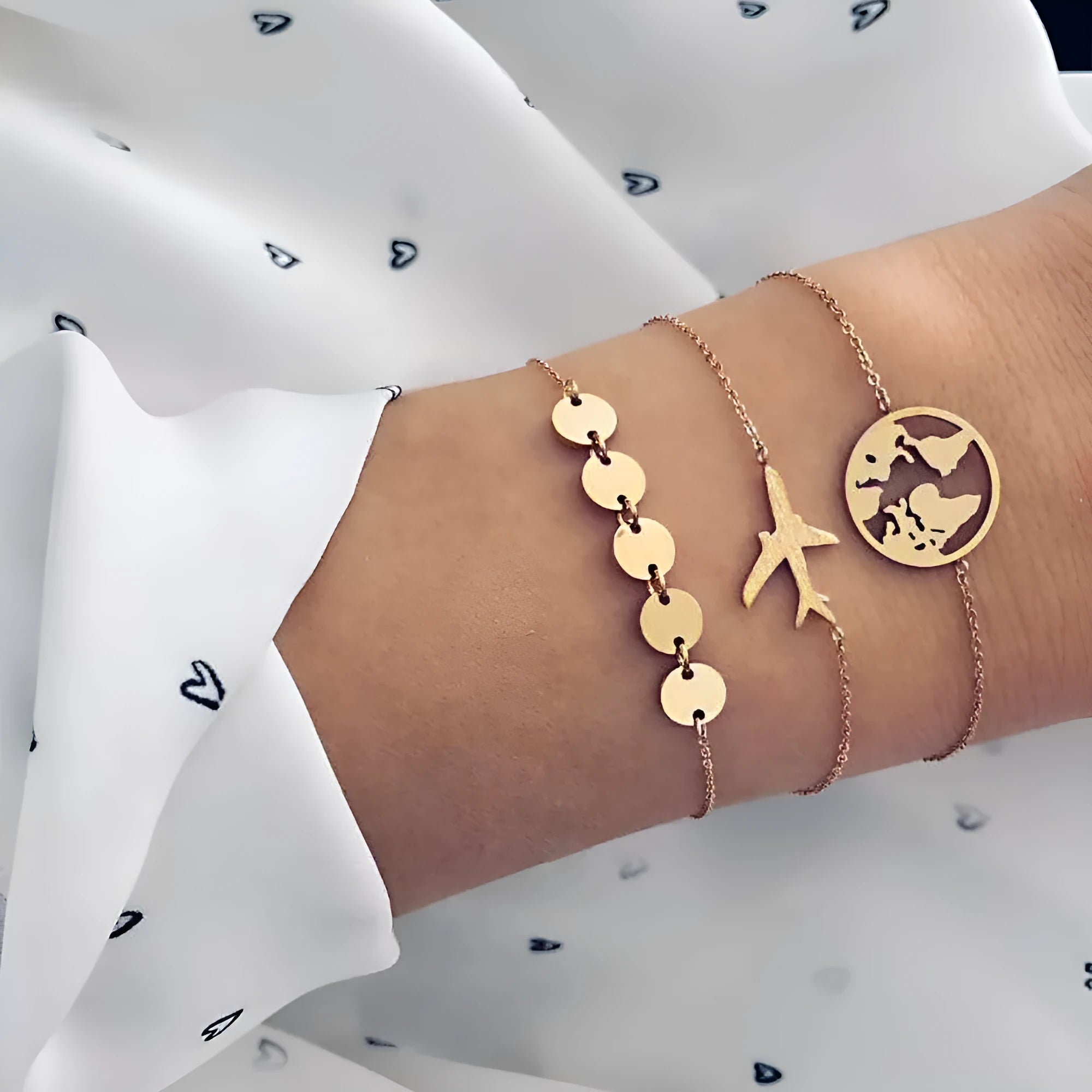 Three women's bracelets with European and American aircraft map charms in heart shape design