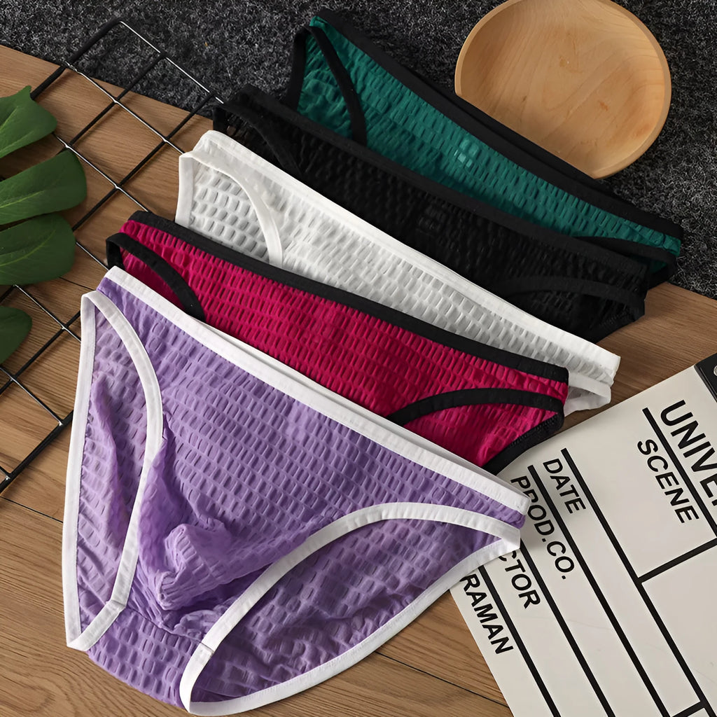 Men's low waist transparent lace underwear in multiple colours on a white background.