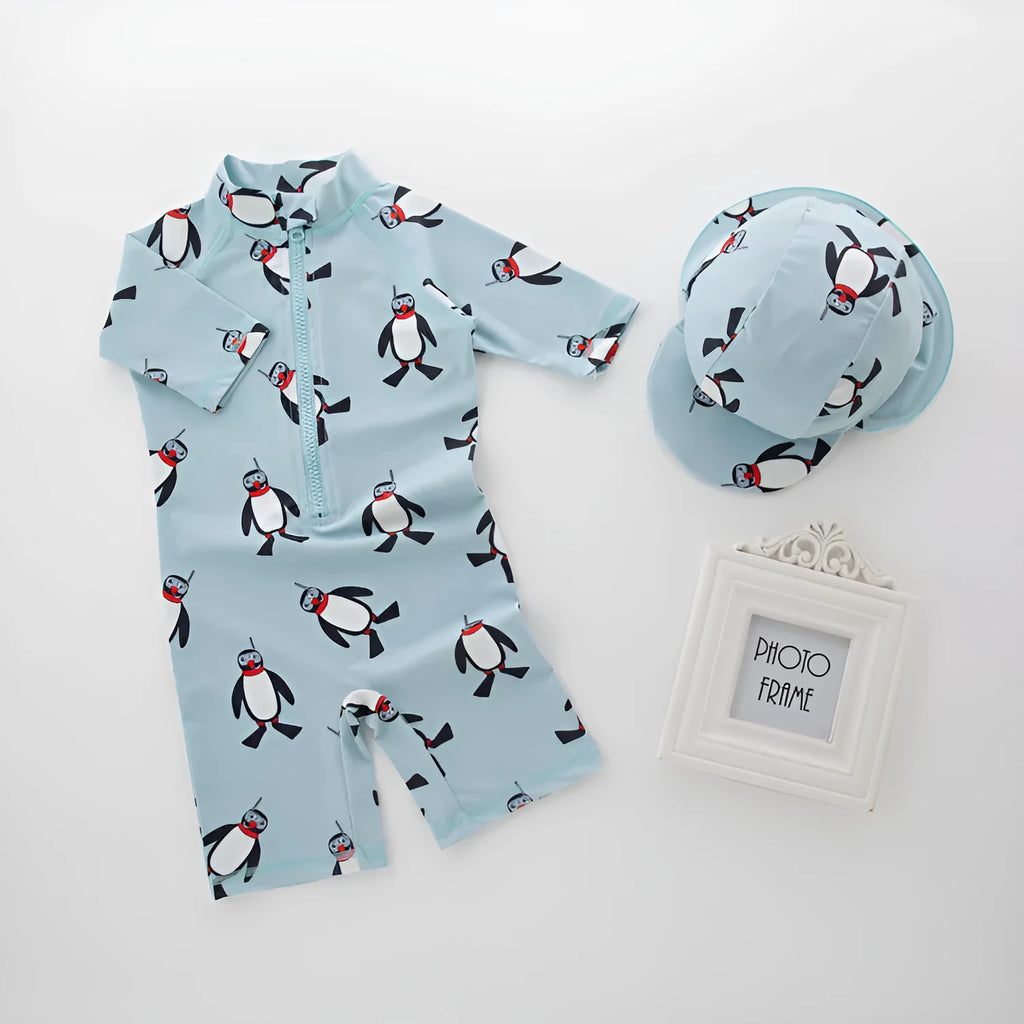 Boys penguin print long sleeve one-piece swimsuit with matching swim cap on size chart