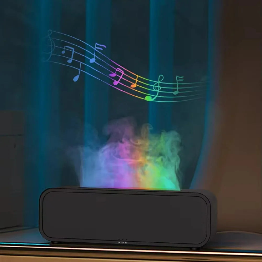 Black and white aroma diffuser with remote control on a table, showing colour-changing LED lights.