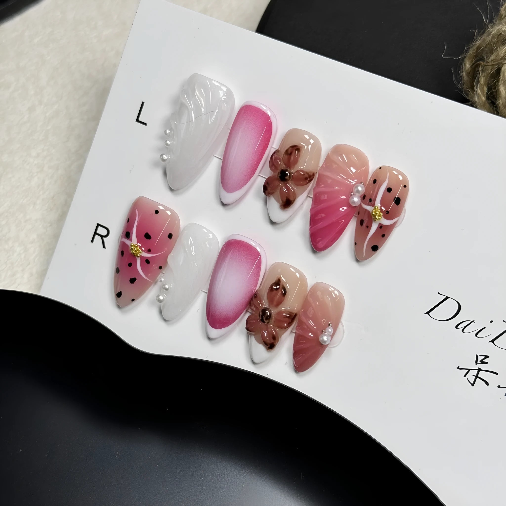 Three-dimensional carved nail art patches with hand-painted designs for almond-shaped nails