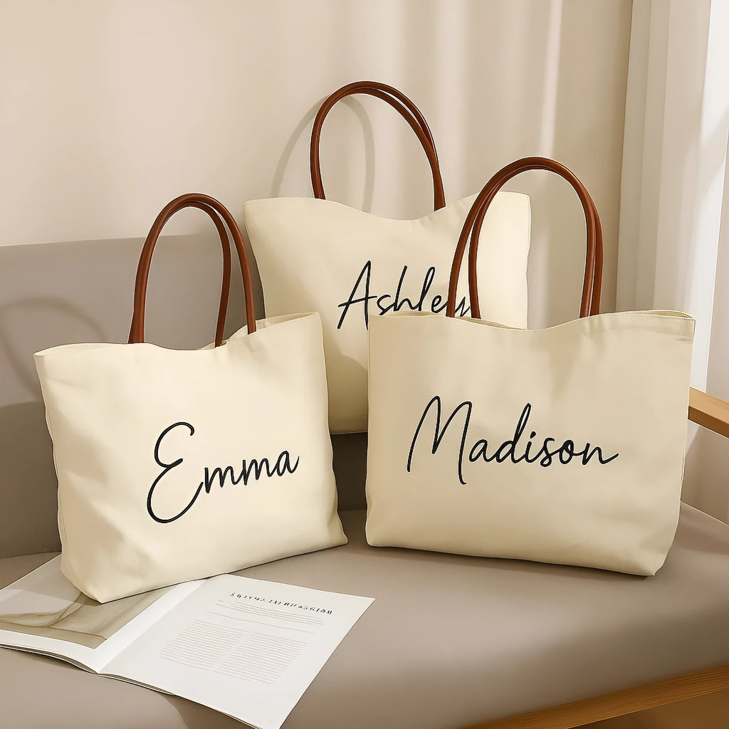 Beige white canvas tote bag with reinforced straps, shown flat and empty.