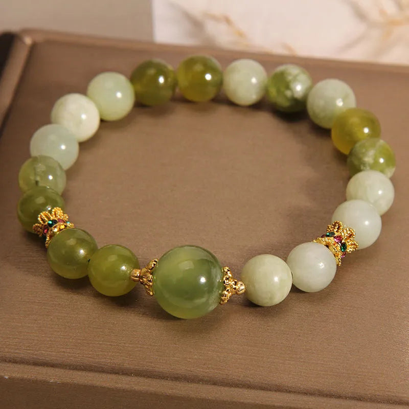 Original design women's bracelet made from green Xiuyan jade in a sweet Mori style.
