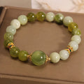 Original design women's bracelet made from green Xiuyan jade in a sweet Mori style.