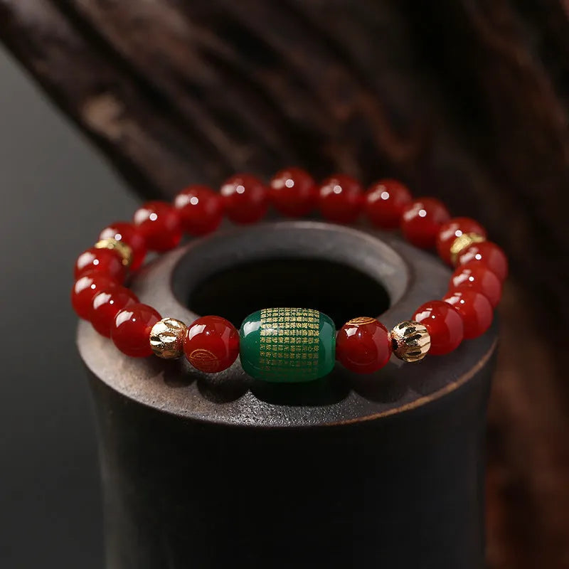 New Chinese style red agate Guanyin bracelet with auspicious patterns on a wrist.