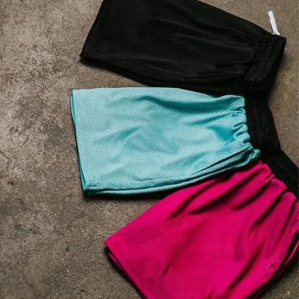 Men's solid colour mesh quick-drying shorts in black, shown laid flat.