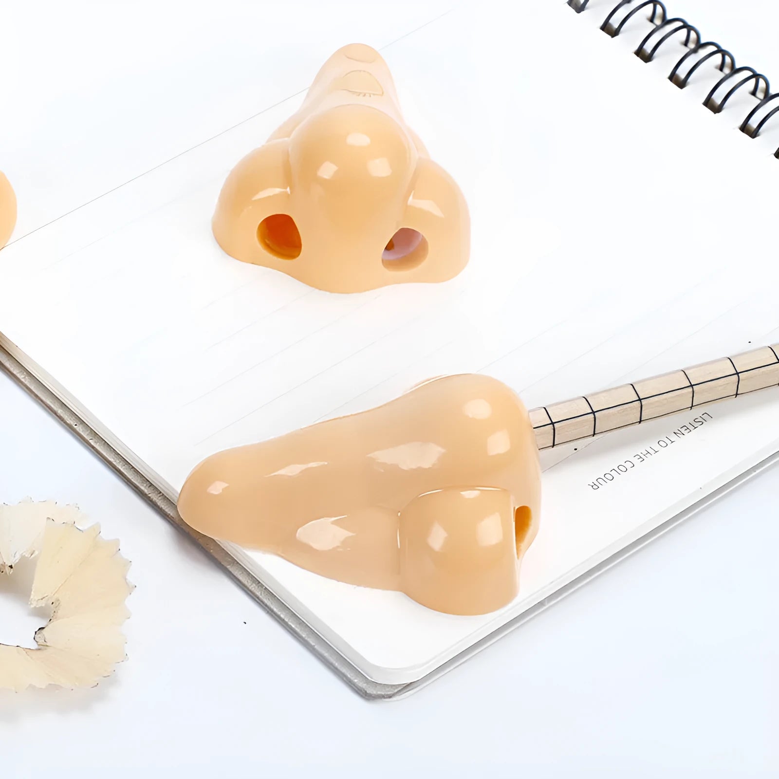 Flesh colour plastic pencil sharpener with geometry shape measuring 58×45×30mm for student stationery