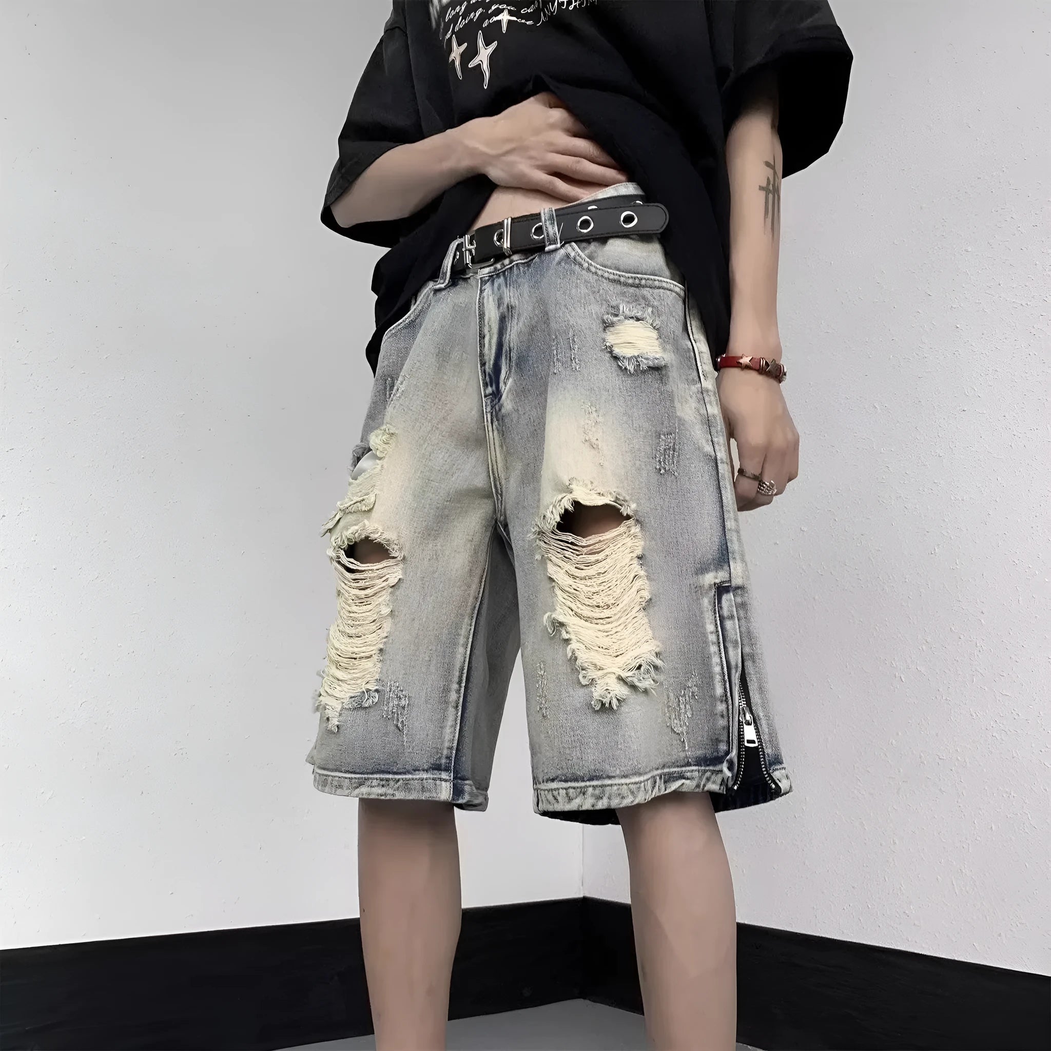 Blue retro-style women's denim shorts with a wide-leg loose fit and tattered detailing.