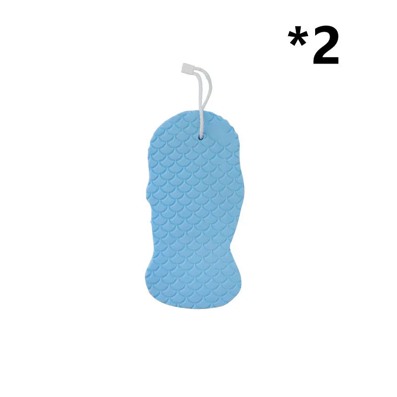 3D white bath sponge with fish scale pattern for gentle body exfoliation.