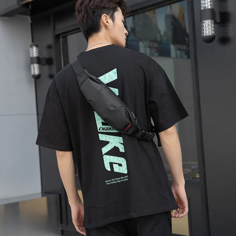 Black Oxford cloth waist pack with crossbody strap and zipper closure