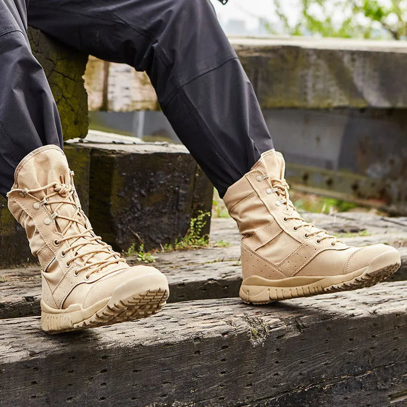 Yulong tactical desert combat boots in black and sand colour on a rocky outdoor terrain.