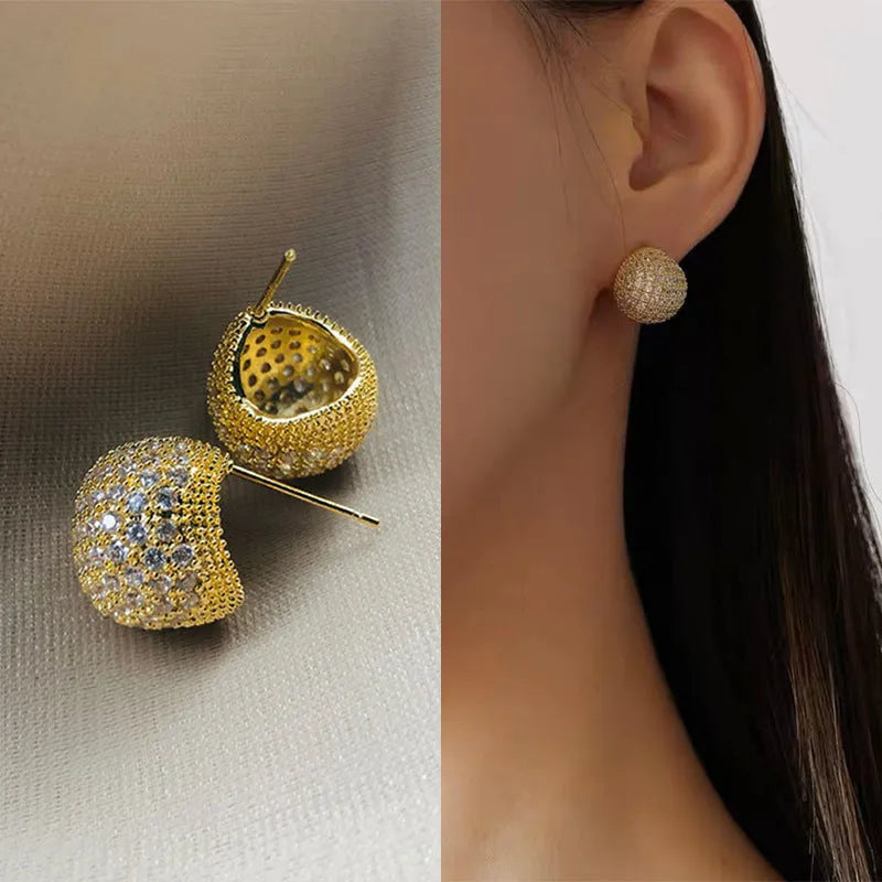 Geometric drop earrings with diamond accents and golden beans in gold and white colours