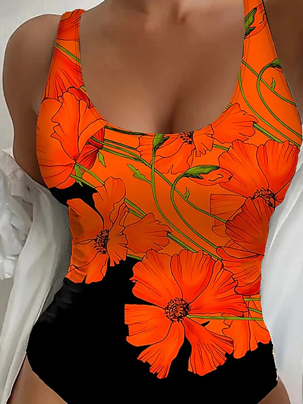 Orange floral print backless one-piece swimsuit laid flat, showing slim fit design.