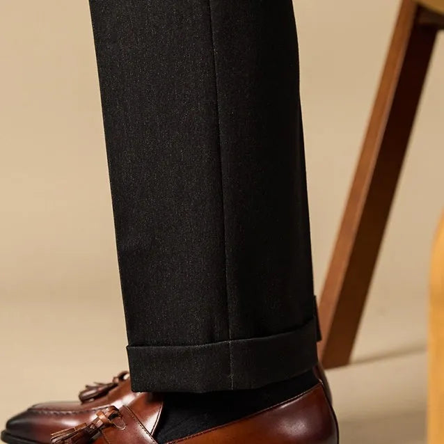 Men's black and brown polished leather tassel loafers with rubber sole