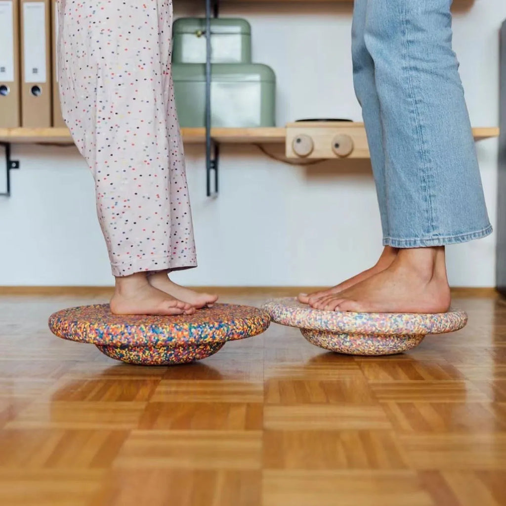 Plastic wood surf balance board for children aged 4-6 with mixed colour wood grain and black design.
