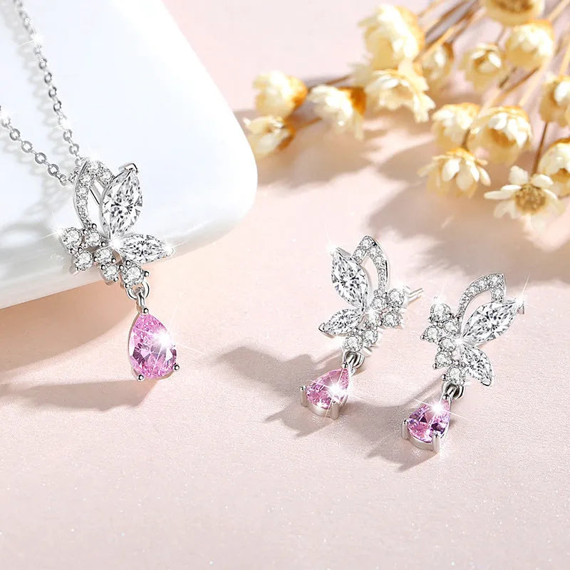 Sterling silver butterfly stud earrings with crystal details on woman's earlobe