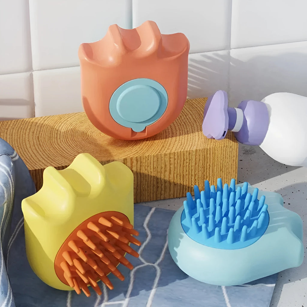 Blue pet bath brush with an integrated shampoo box, shown next to an orange and yellow version.