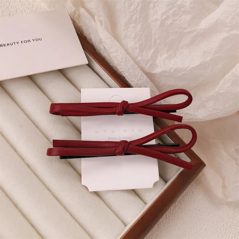 Wine red leather bow hair barrettes with handmade construction