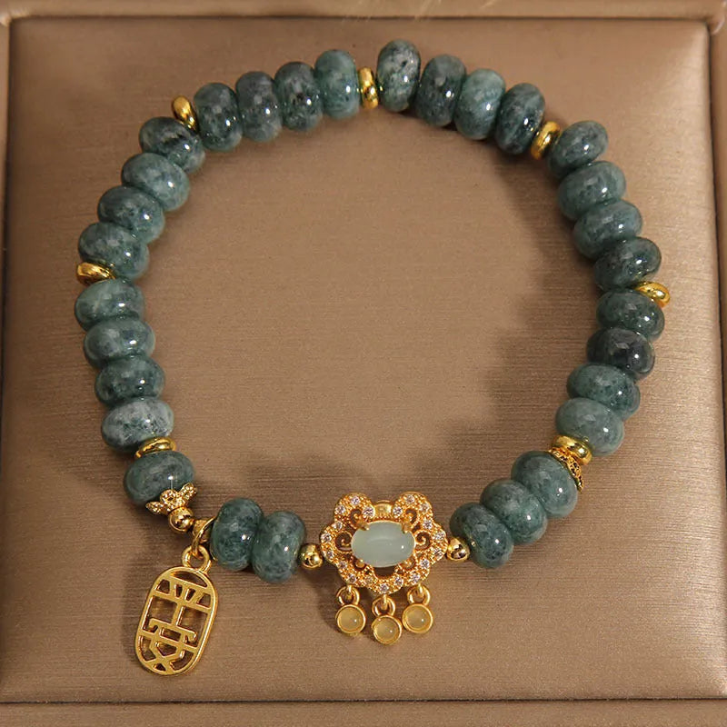 Women's natural emerald jade bracelet with alloy construction showing abacus bead design and safety lock closure