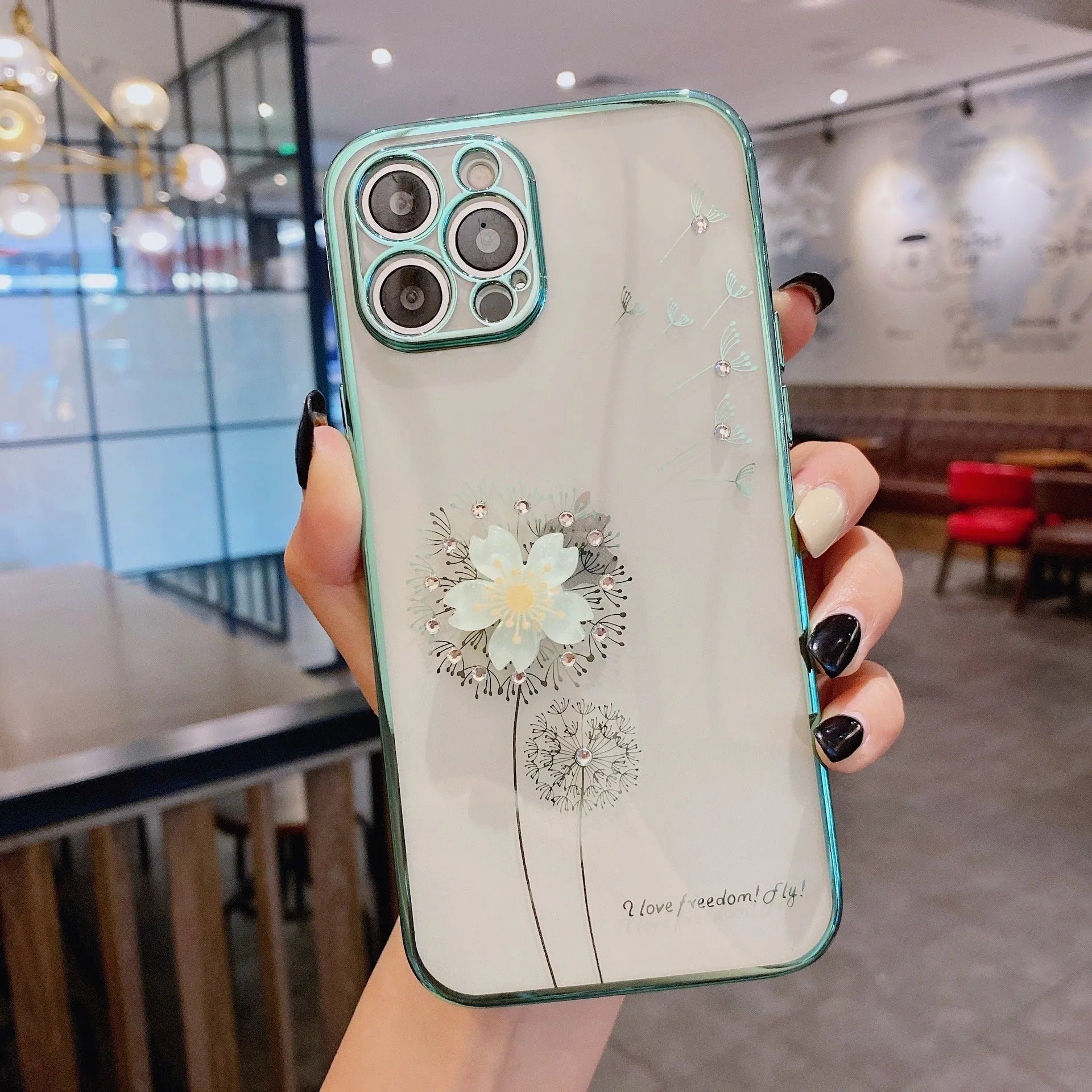 Green iPhone case with 3D flower spin stand and built-in screen protector shown on iPhone 13