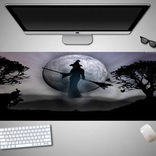Oversized Halloween-themed mouse pad with non-slip rubber cloth base on a desk