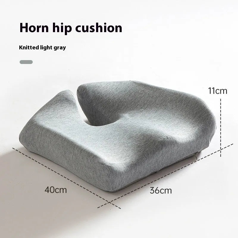 Memory foam office chair cushion with waist support in grey colour on wooden chair