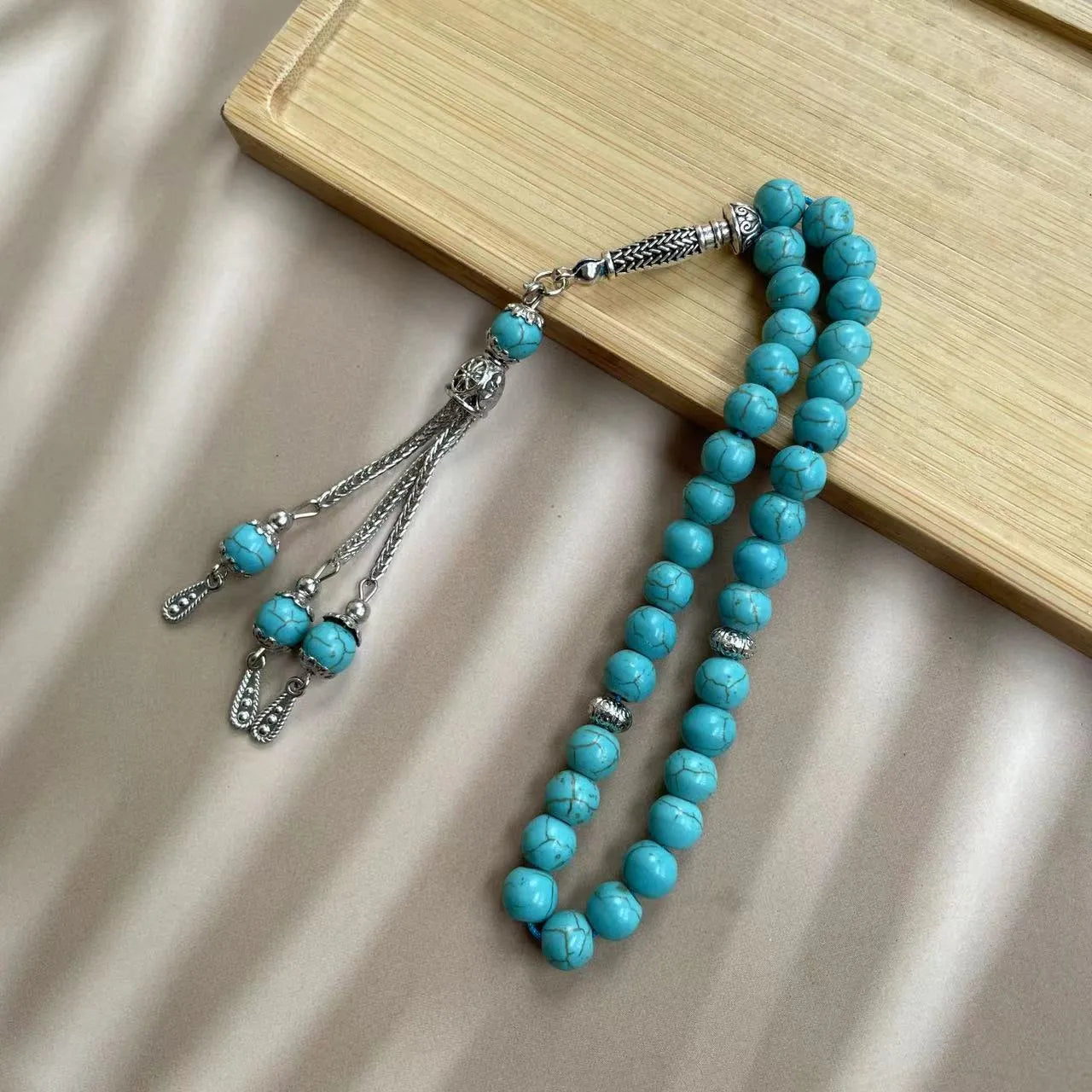Handmade Muslim daily worship bracelet with 8mm sky blue stone beads on wrist