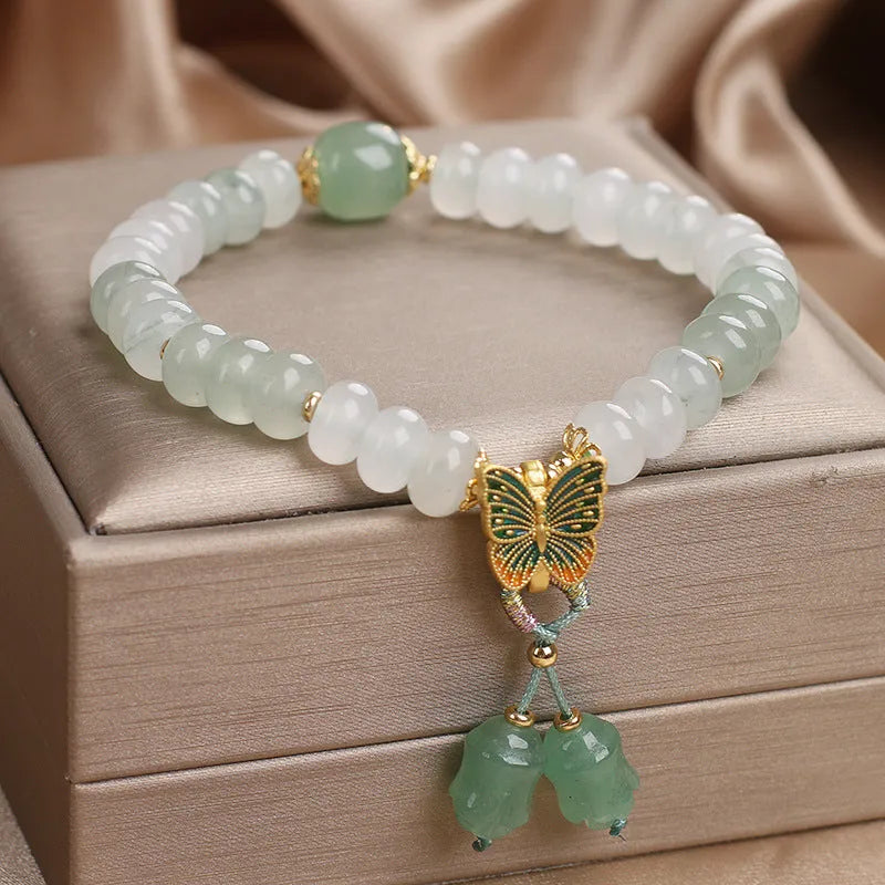 Green Tian Shan Cui abacus bead bracelet with retro butterfly tassel and pearl accents