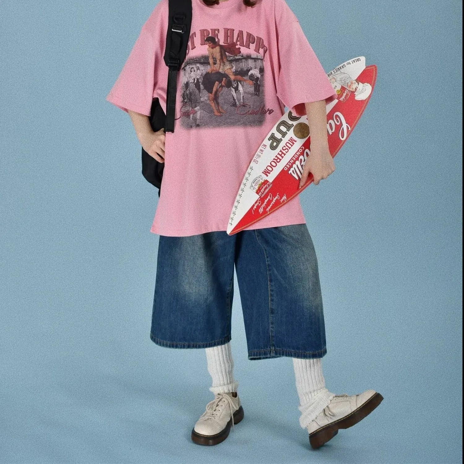 Men's loose straight fit denim shorts in blue, shown on a model for summer.
