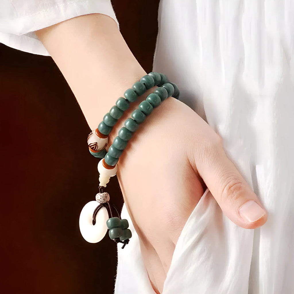 White Bodhi seed bead bracelet with metal safety buckle and lotus clasp