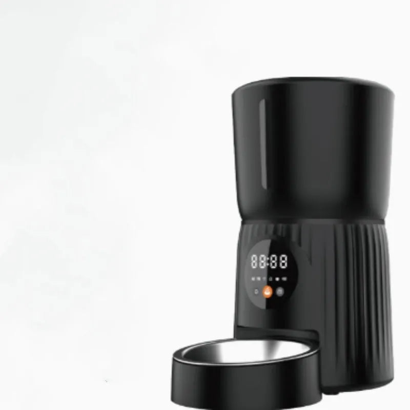 Black and white automatic pet feeder with digital display and food chamber for timed portion control