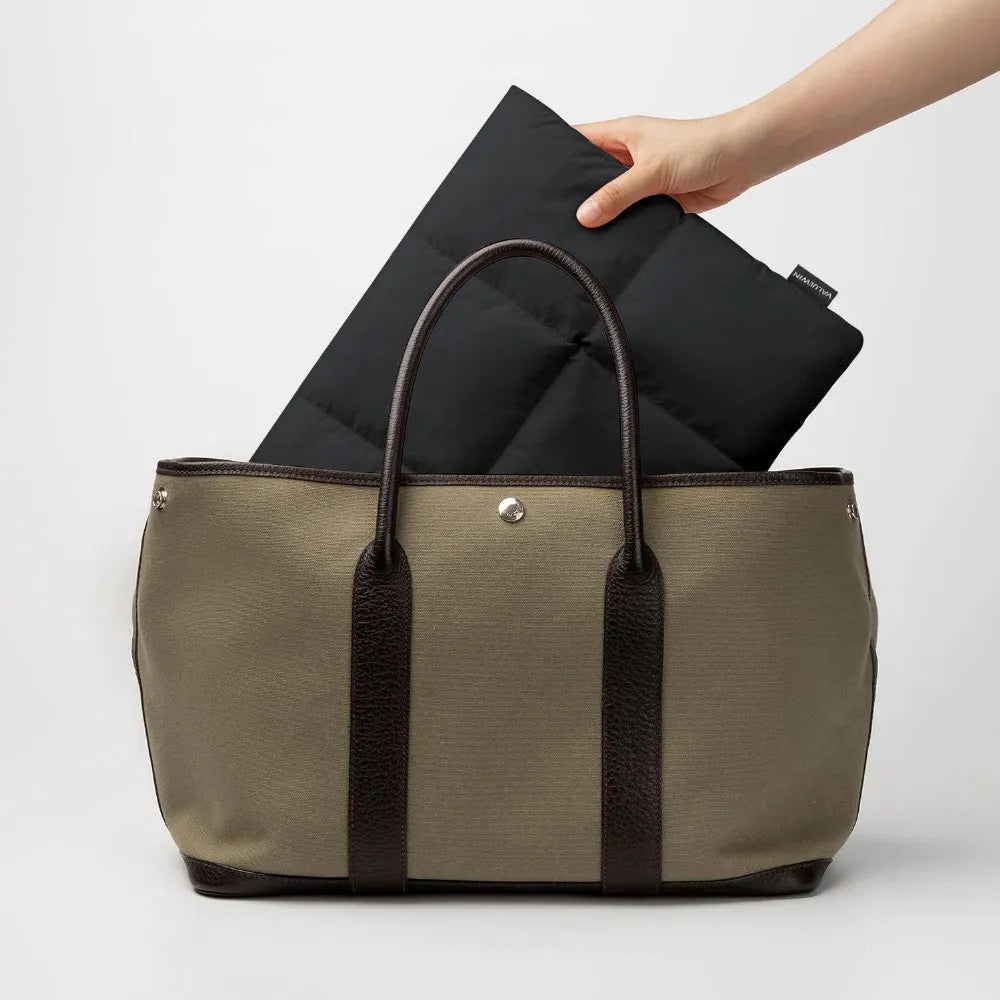 Soft fluffy laptop sleeve for 13-15.6 inch devices in black or khaki with visible sewing thread detailing