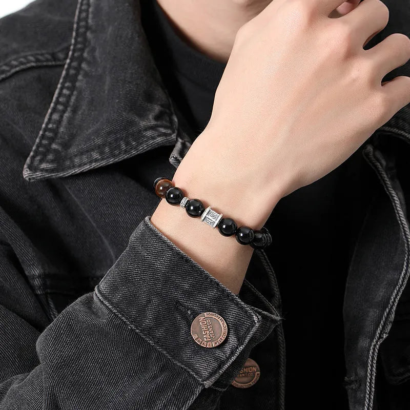 Men's obsidian bracelet with pure silver elements and six-word mantra prayer wheel design