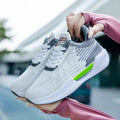 Men's blue casual sports shoes with breathable mesh cloth upper and round toe on a plain background.