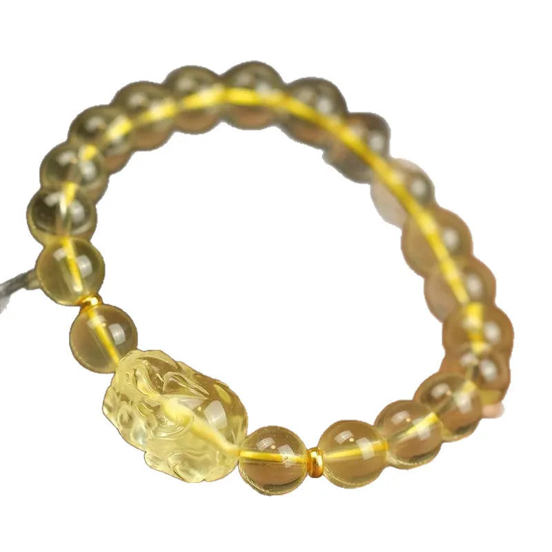 Yellow leather bracelet with artificial crystal Pi Xiu bead in simple Chinese style.