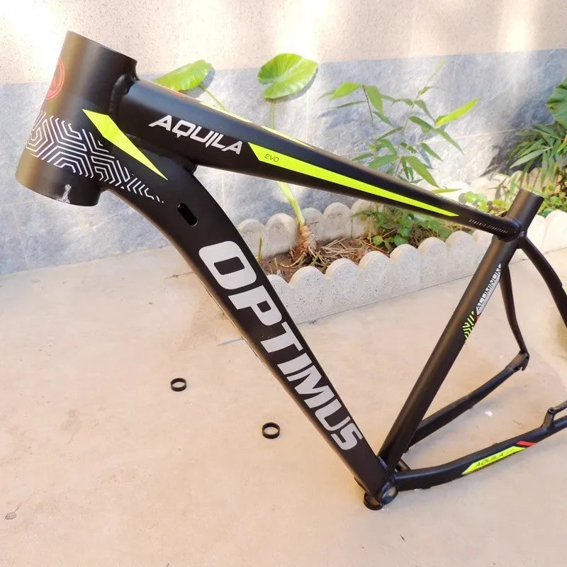 Black green aluminium 29-inch mountain bike frame showing disc brake mount and inner cable ports.