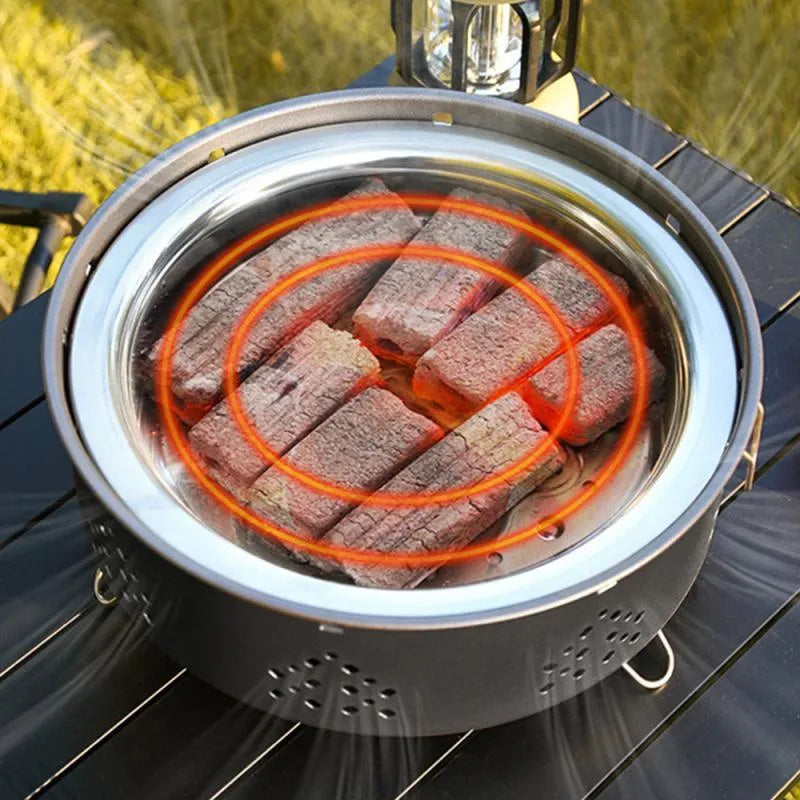Portable stainless steel barbecue grill with detachable design and storage bag for camping.