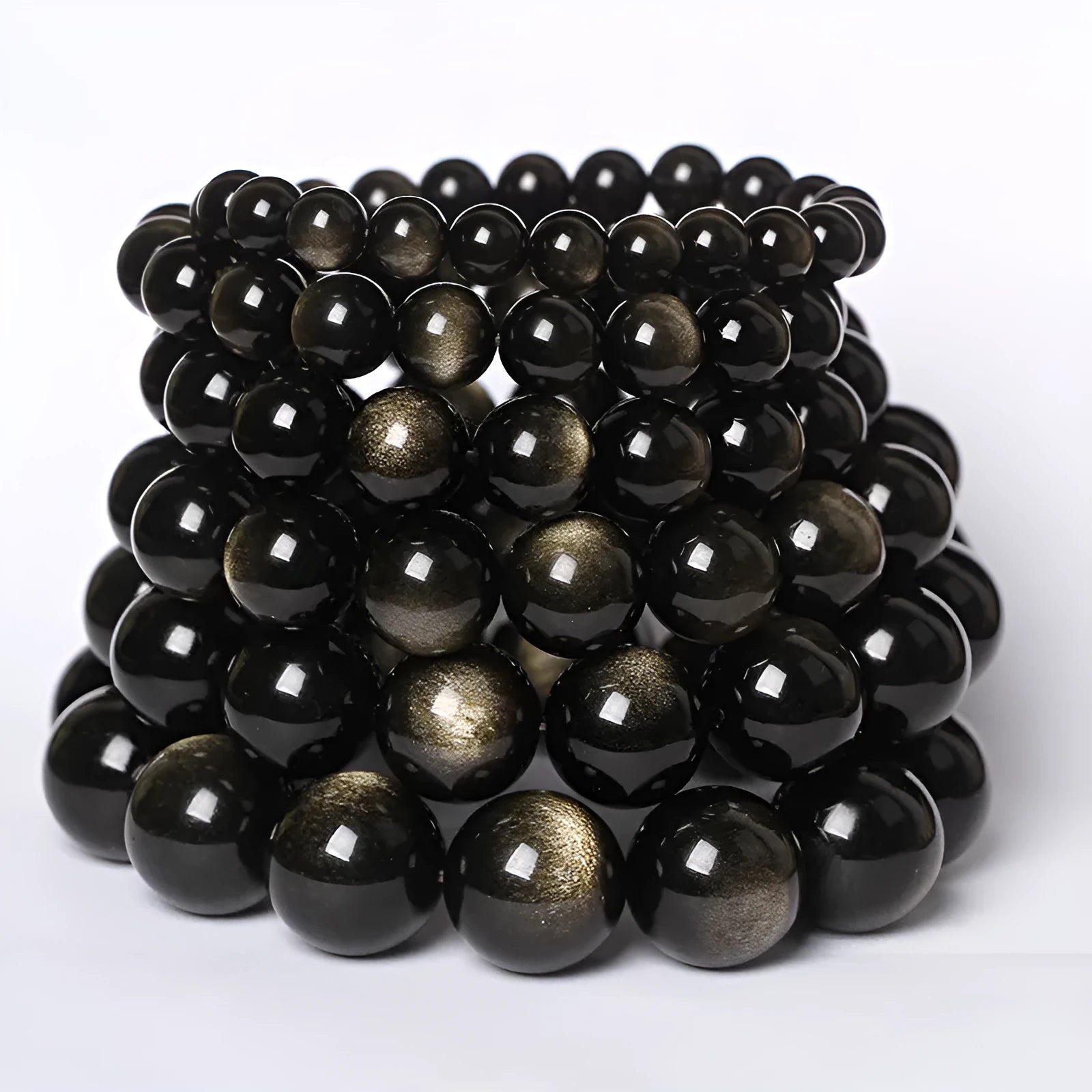Hand-woven round obsidian bead bracelet for couples, showing colour options on a wrist.