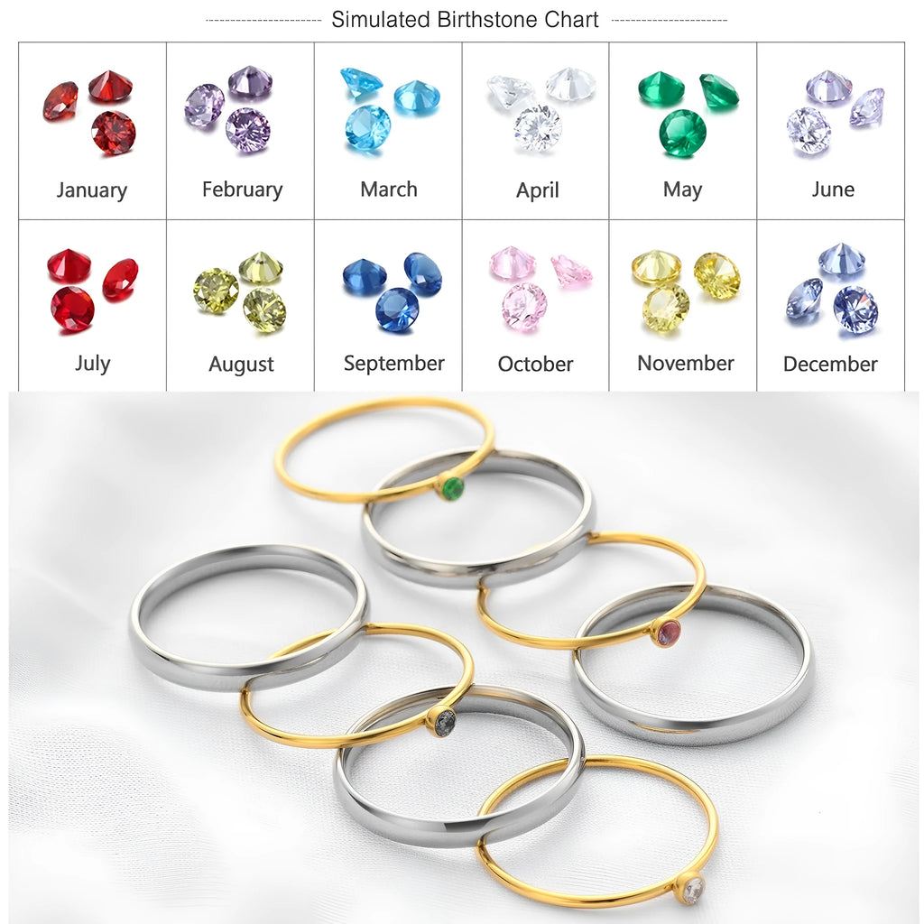 December birthstone geometric engraved ring in titanium steel with gold-coloured handle on a grey background.