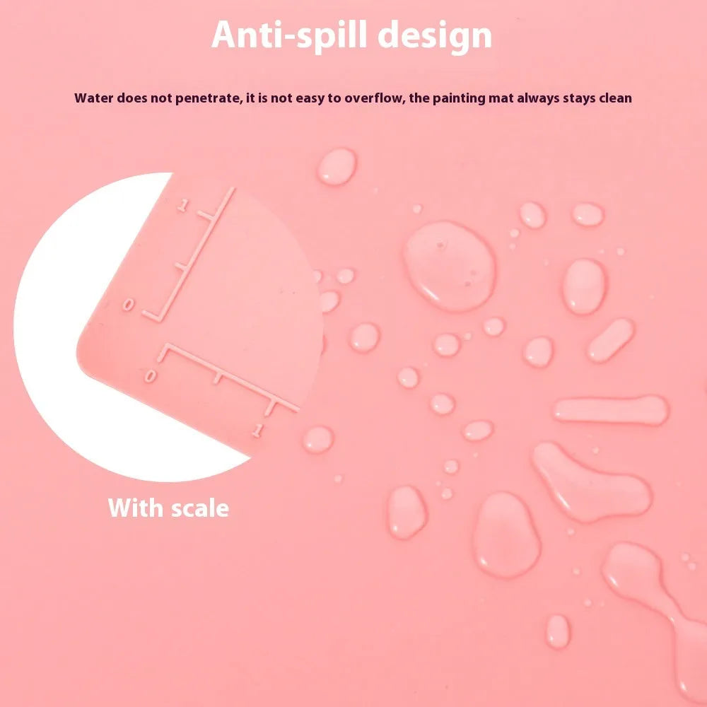 Light blue silicone painting mat with two attached bowls for watercolour supplies.