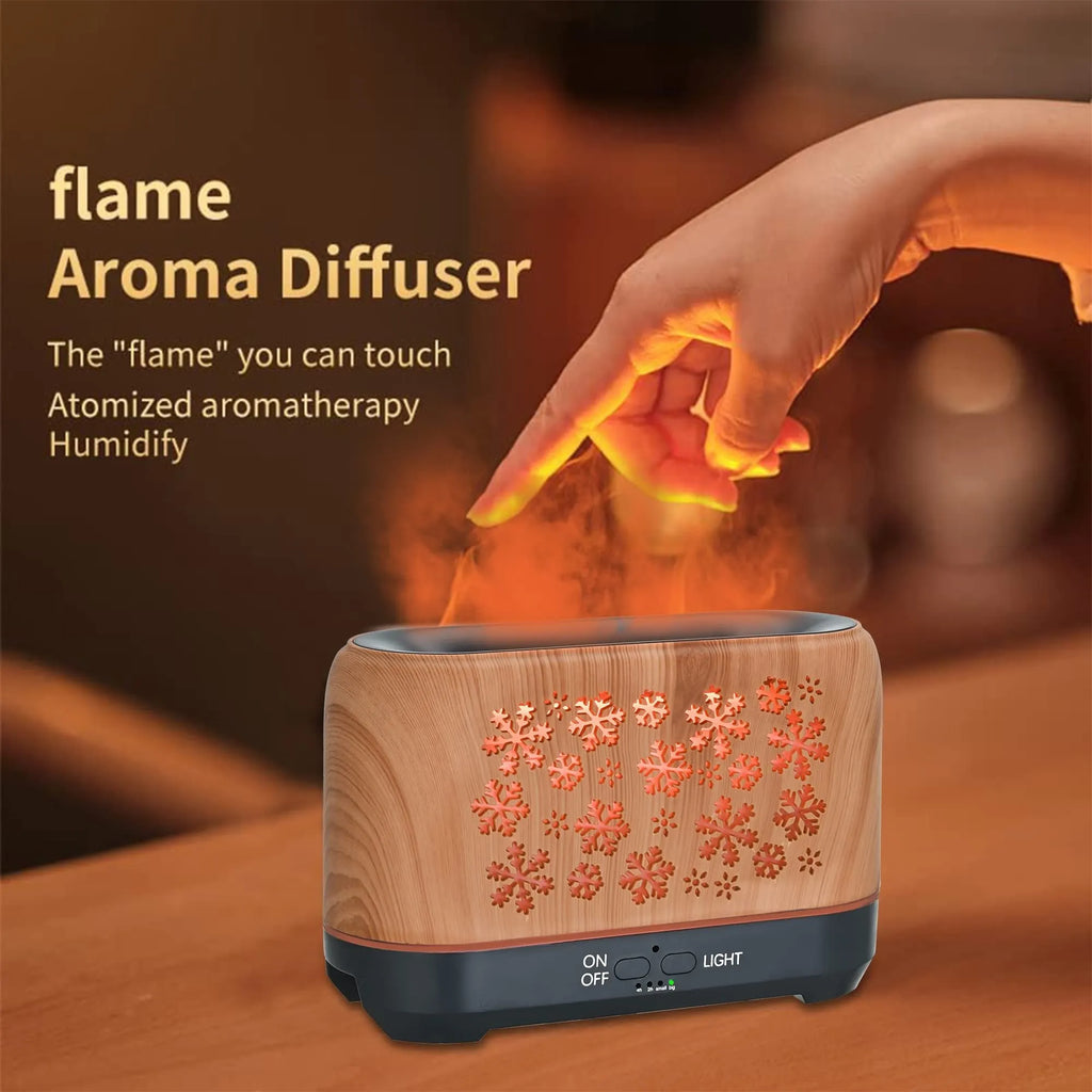 Christmas snowflake pattern ultrasonic aromatherapy humidifier with colourful flame light effect on a desk.