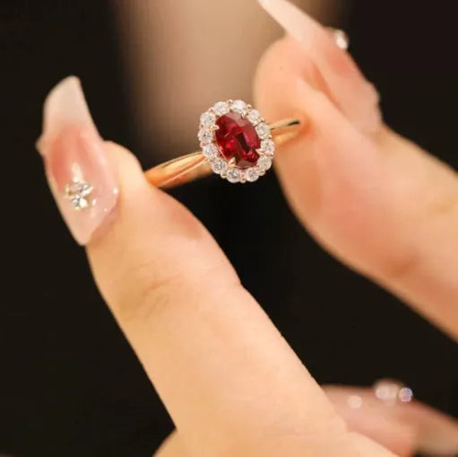 Sterling silver ring with gold pigeon design, floral pattern and red blood gemstone accents