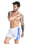 Men's blue lace-up sports shorts with slim fit design and stretch polyester fabric