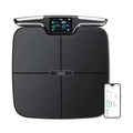 Black eight-electrode intelligent body fat scale on a bathroom floor