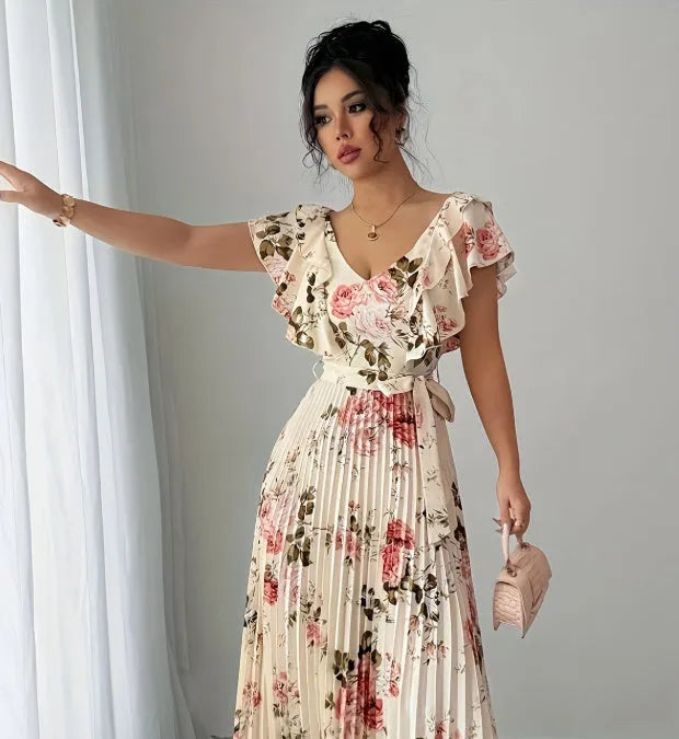 Apricot floral print V-neck dress with ruffled sleeves and a voluminous high-waisted swing skirt.