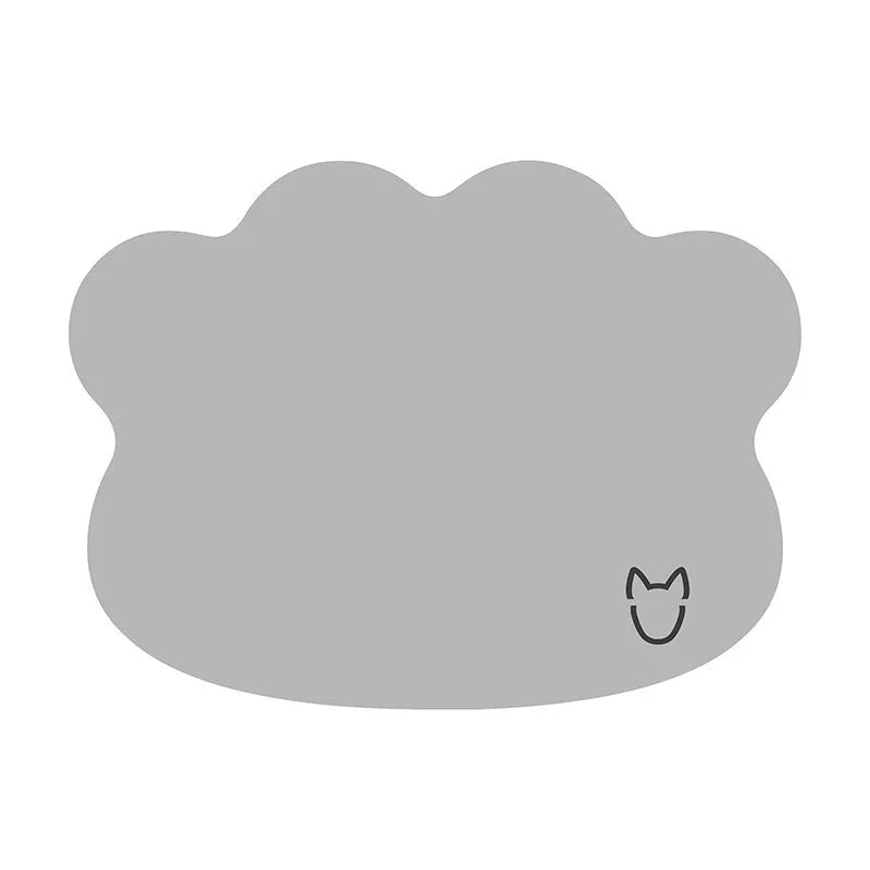 Ice silk pet cooling mat for dogs in a simple dog head shape, shown in a light grey colour on a wooden floor.