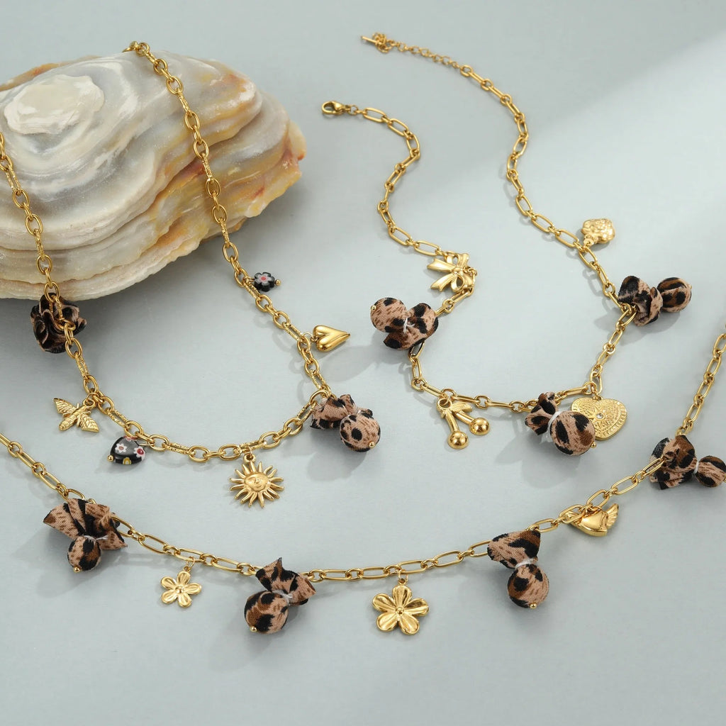 Leopard pendant with heart and flower elements on stainless steel necklace, electroplated 18K finish